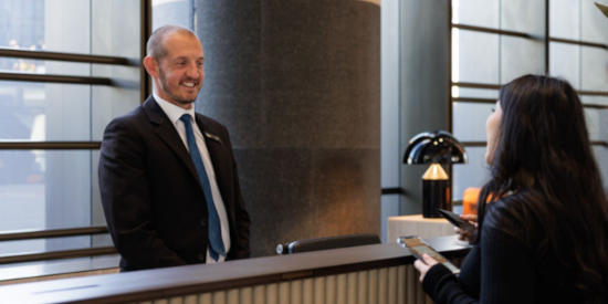 Visitor talking to a concierge at Parramatta Square