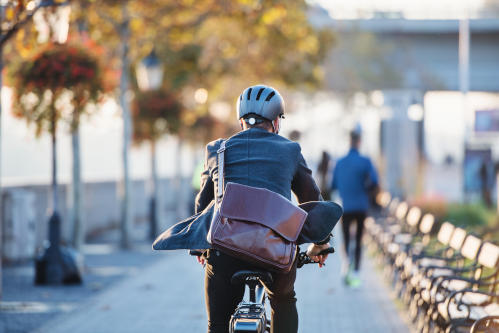 Patron riding a bycicle to work at Parramatta Square