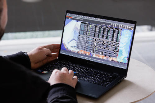 A person using a laptop, exploring a sustainability dashboard at Parramatta Square