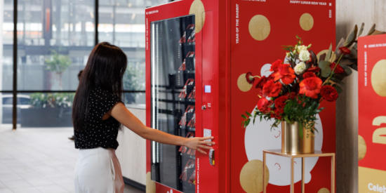 Visitors using a vending machine at Parramatta Square